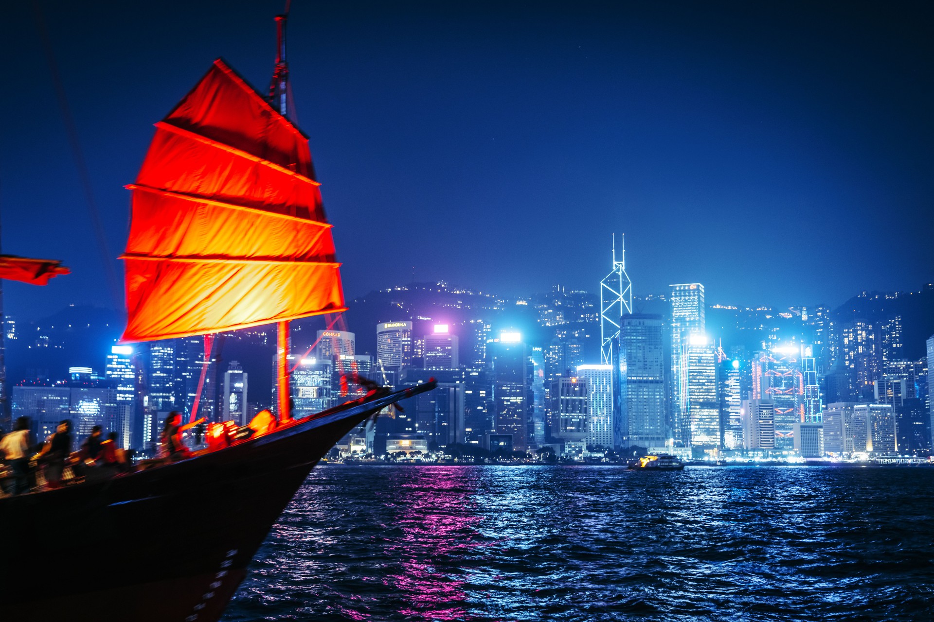 Hong Kong Night View with Traditional Junk Boat