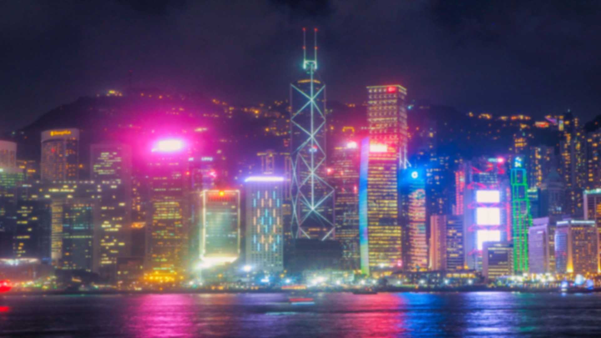 Blurred abstract background lights, beautiful cityscape view of Hong Kong city skyline at night in Hong Kong.